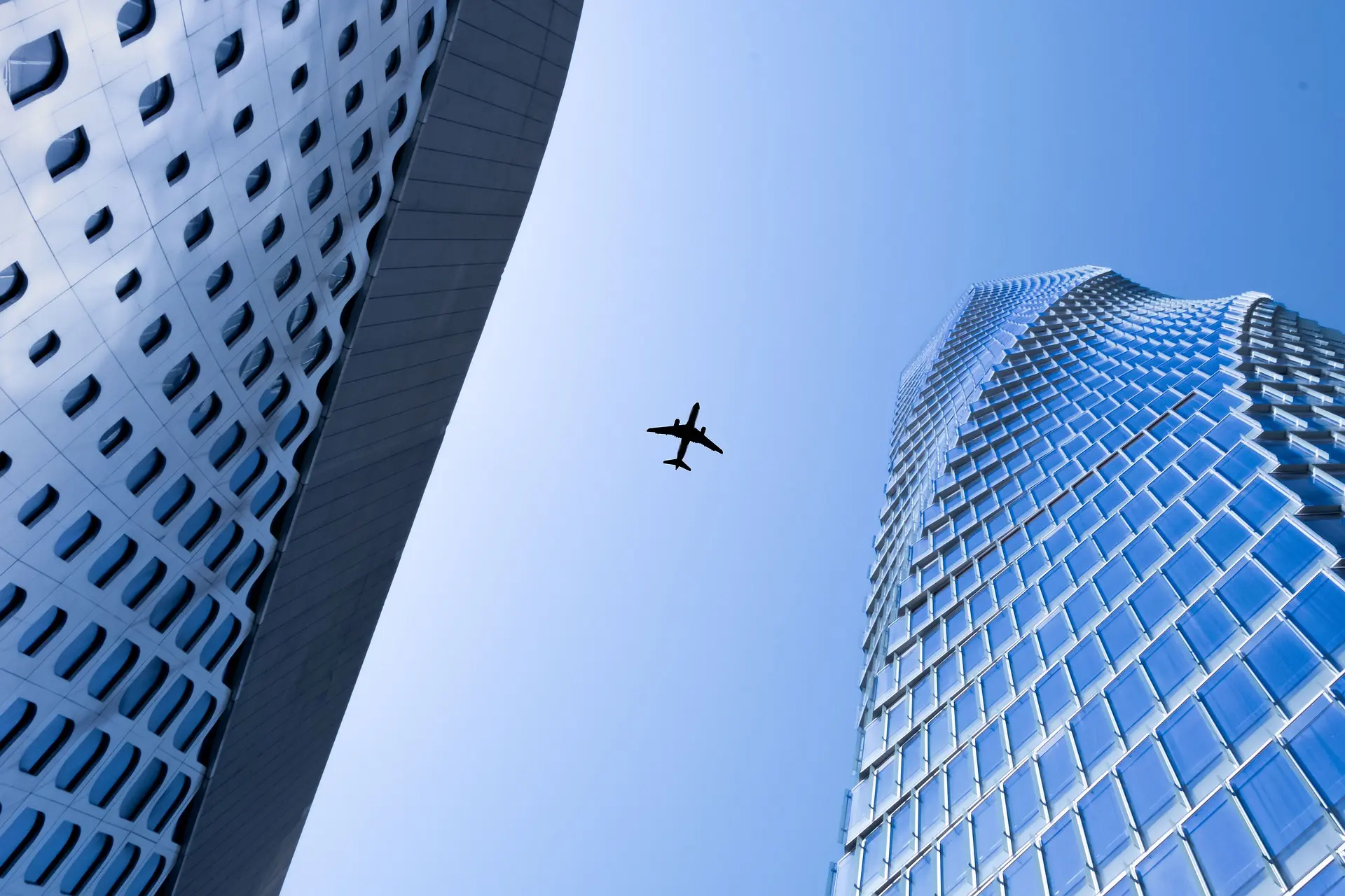 Plane flying over the city